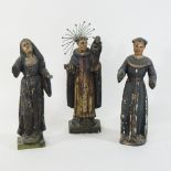 Three 18th century Spanish Santos carved wooden figures, of religious subjects,