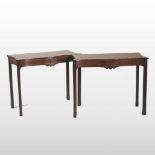 A pair of 18th century style mahogany serpentine side tables,