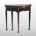 A rare George III mahogany double folding tea/card table, on pad feet,