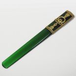 An ornate Faberge style silver gilt mounted jade letter opener, of plain shape,