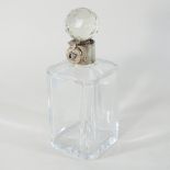 An early 20th century silver mounted glass decanter and stopper, with a lockable silver collar,