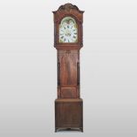 A late George III mahogany and inlaid cased longcase clock, the arched painted dial with moon phase,