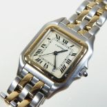 A Cartier bi-colour ladies wristwatch, the square dial with Roman hours, on a flexible link strap,