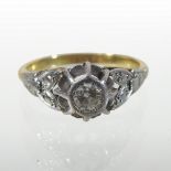 An 18 carat gold and platinum illusion set diamond ring,
