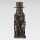 A carved oak figure of a bearded gentleman, seated on a gothic armchair,