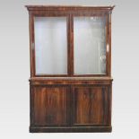 A Victorian rosewood cabinet bookcase, of large proportions, with a glazed upper section,