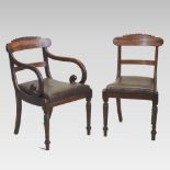 A set of eight William IV carved mahogany dining chairs, each having a bar back and drop in seat,