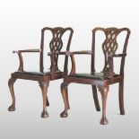 A pair of early 20th century mahogany open armchairs,