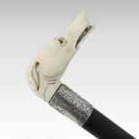 An Edwardian carved ivory handled novelty walking stick,