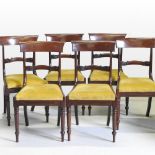 A set of six Regency mahogany dining chairs, each having a bar back and yellow drop in seat,