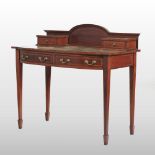 An Edwardian mahogany and inlaid writing desk, with an inset writing surface,