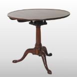 A George III mahogany tripod table, with a birdcage action,