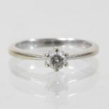 An 18 carat white gold diamond solitaire ring, approximately 0.