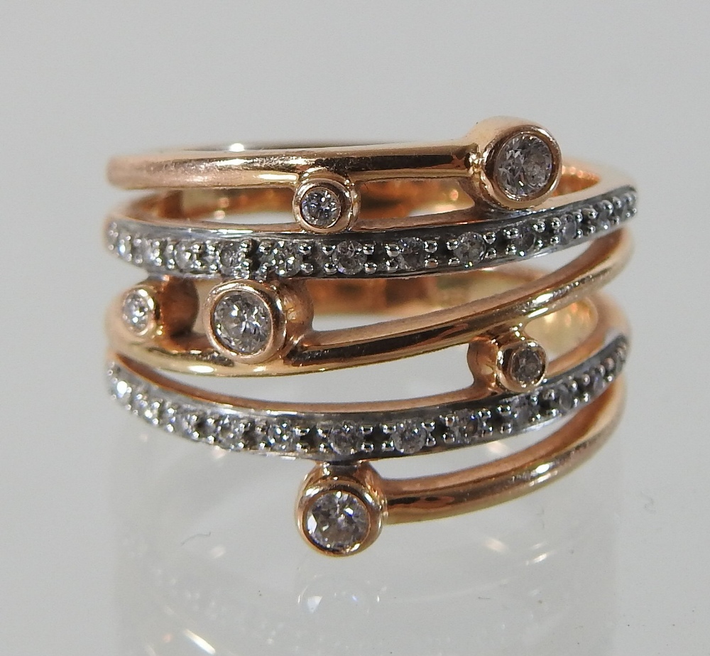 A modern rose gold and white gold diamond ring, of asymmetrical design, - Image 4 of 5