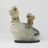 A carved rock crystal sculpture of two parrots,