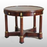 An Empire style parcel gilt side table, of circular shape, united by a star shaped undertier,