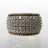A 9 carat gold and diamond pave set band, approximately 1.