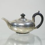 An Edwardian silver teapot, of compressed circular shape, Chester 1904,