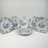 A pair of 18th century Chinese porcelain famille rose plates, each painted with flowers,