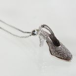 An 18 carat white gold and diamond pendant, in the form of a high heel shoe, approximately 0.