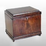 A George III mahogany cellarette, of plain rectangular shape, with a cavetto moulded hinged lid,
