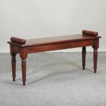 A Regency style mahogany window seat, on turned legs,