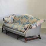 A blue floral upholstered Georgian style hump back sofa,