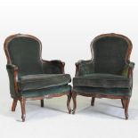 A pair of French style green upholstered armchairs,