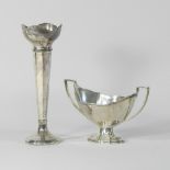 An early 20th century silver sauce boat, Birmingham 1936, together with a silver spill vase,