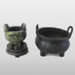 A 19th century Asian cast iron censer, of twin handled circular shape,