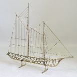 An American brass model of a sailing ship, signed indistinctly and dated 1976,