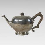 A George III style silver teapot, of circular shape, London 1924,