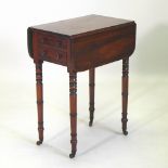 A Regency mahogany drop leaf ladies work table, containing two short drawers, on ring turned legs,