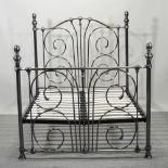 A Victorian style metal framed double bedstead,
