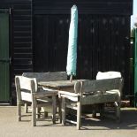 A rustic garden table, 132 x 78cm, together with two matching benches,