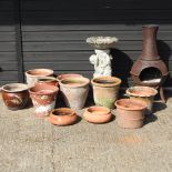 A collection of various garden pots, together with a chiminea,