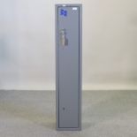 A metal gun cabinet, 131cm high,