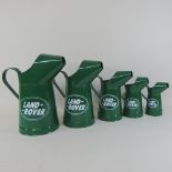 Five painted metal Landrover oil cans,