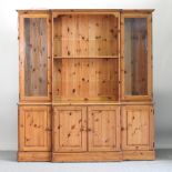 A pine dresser, with a glazed upper section,