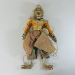 An early 20th century Indonesian painted wooden puppet,