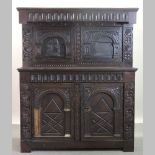 A 19th century continental carved oak side cabinet,