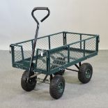 A green painted metal garden hand cart,