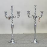 A pair of plated table candelabra,