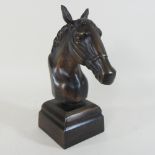 A metal horse head bust,