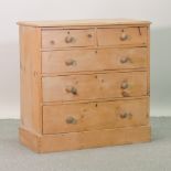 An antique pine chest of drawers,