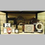 Two shelves of clocks to include an Edwardian mantel clock and an Art Deco mantel clock,