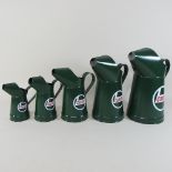 Five modern painted metal Castrol oil cans,