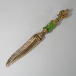 An ornate Faberge style silver gilt and diamond set paper knife,