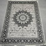 A Keshan style carpet, on a grey ground,