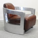 A metal aviator style armchair,